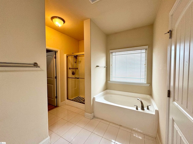 bathroom featuring tile patterned flooring and plus walk in shower