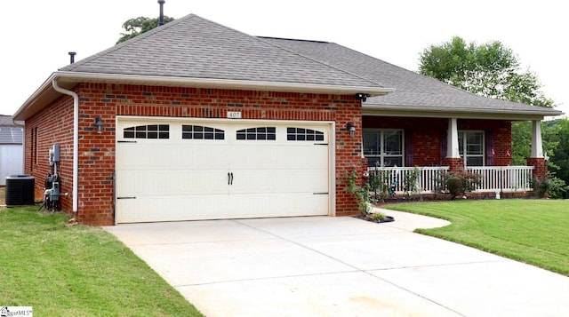 view of front facade with a porch, a garage, central air condition unit, and a front lawn