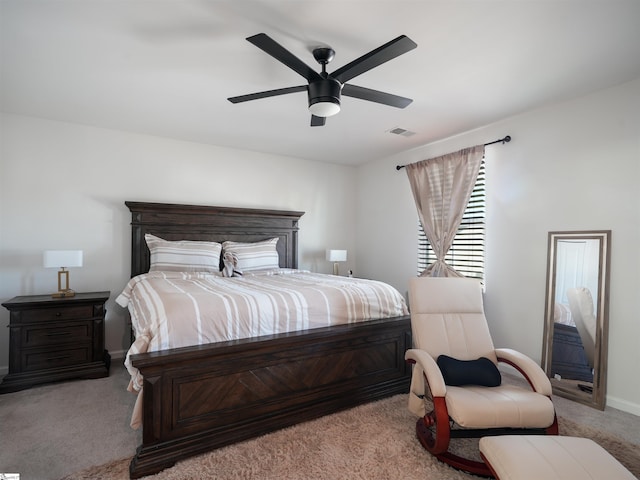 bedroom with light carpet and ceiling fan