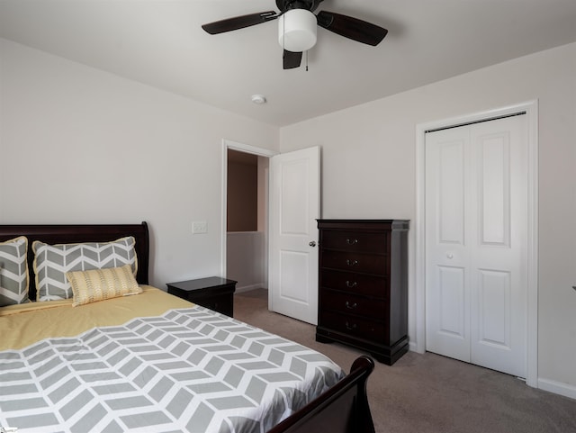 bedroom featuring ceiling fan, dark carpet, and a closet