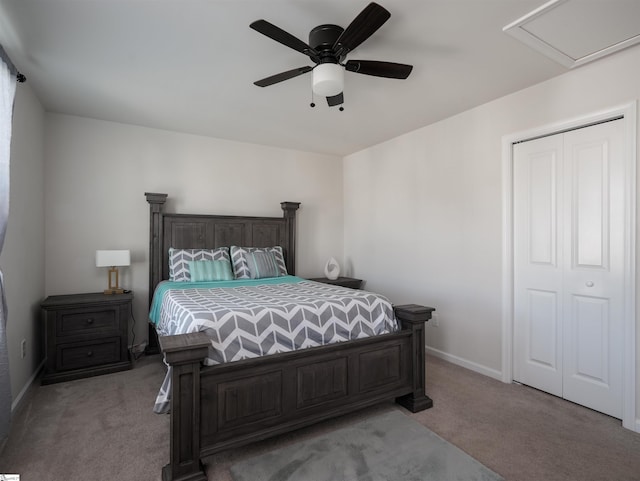 carpeted bedroom with a closet and ceiling fan