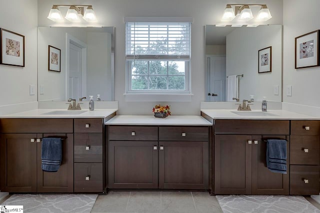 bathroom with tile patterned floors and vanity