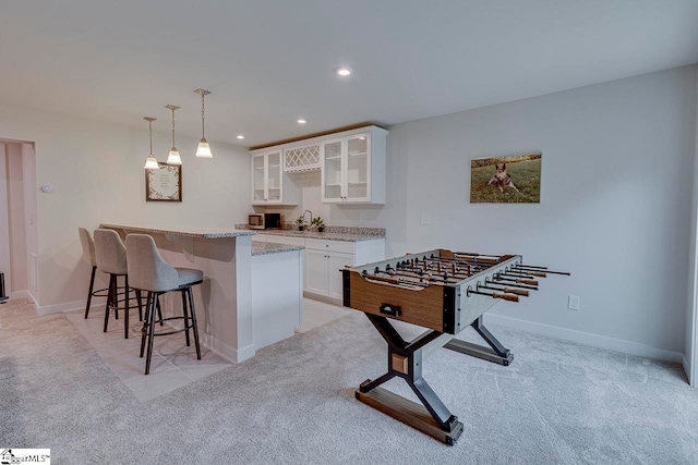 game room with light colored carpet