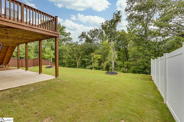 view of yard with a patio area and a deck