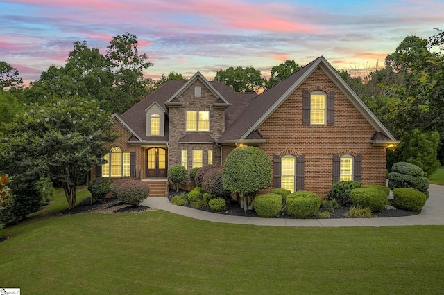 view of front of house with a yard