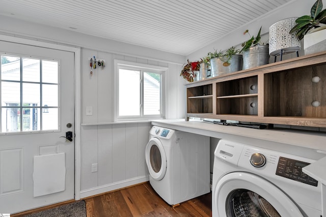 laundry room with dark hardwood / wood-style flooring and independent washer and dryer