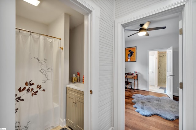 bathroom with hardwood / wood-style flooring, vanity, and ceiling fan