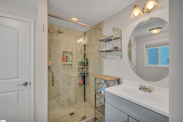 bathroom featuring vanity and an enclosed shower