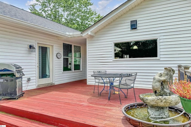 wooden deck featuring grilling area