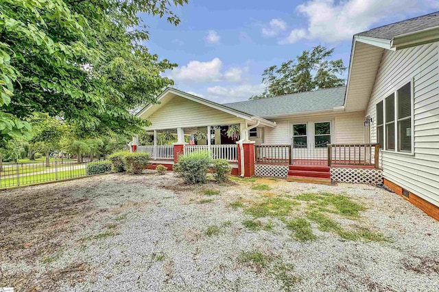 exterior space featuring a wooden deck