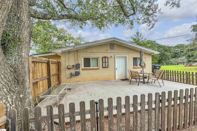 rear view of property featuring a patio area