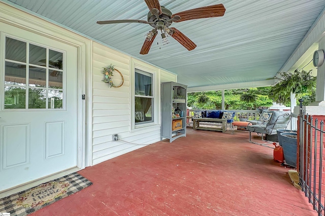 exterior space with a porch and ceiling fan