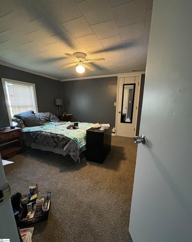 bedroom with carpet, ceiling fan, and ornamental molding