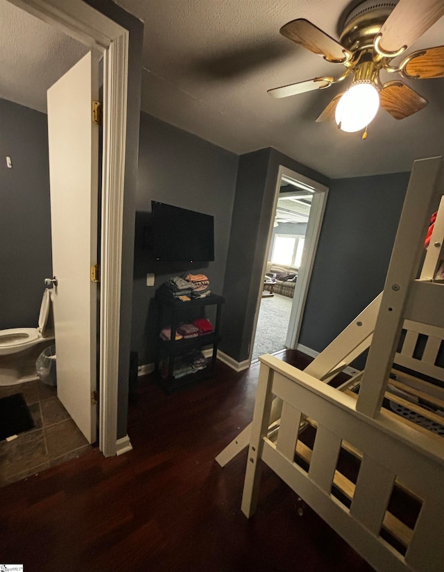 bedroom featuring ceiling fan and hardwood / wood-style flooring