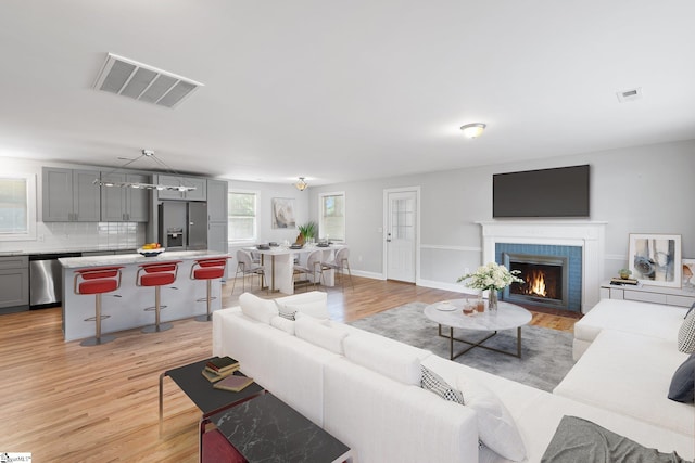 living room with light hardwood / wood-style flooring