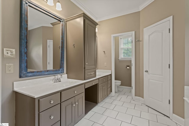 bathroom featuring tile patterned floors, vanity, toilet, and crown molding