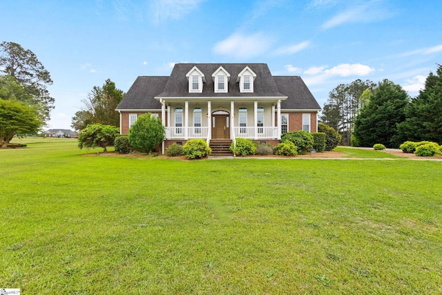 cape cod-style house with a porch and a front yard