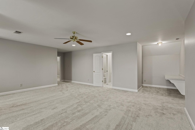 unfurnished bedroom featuring ceiling fan and light carpet