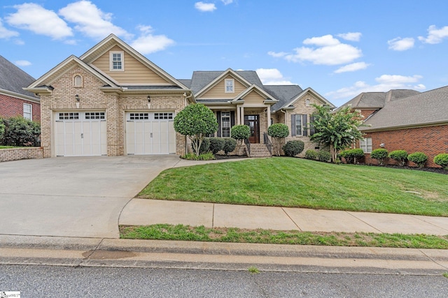 craftsman inspired home with a front lawn and a garage