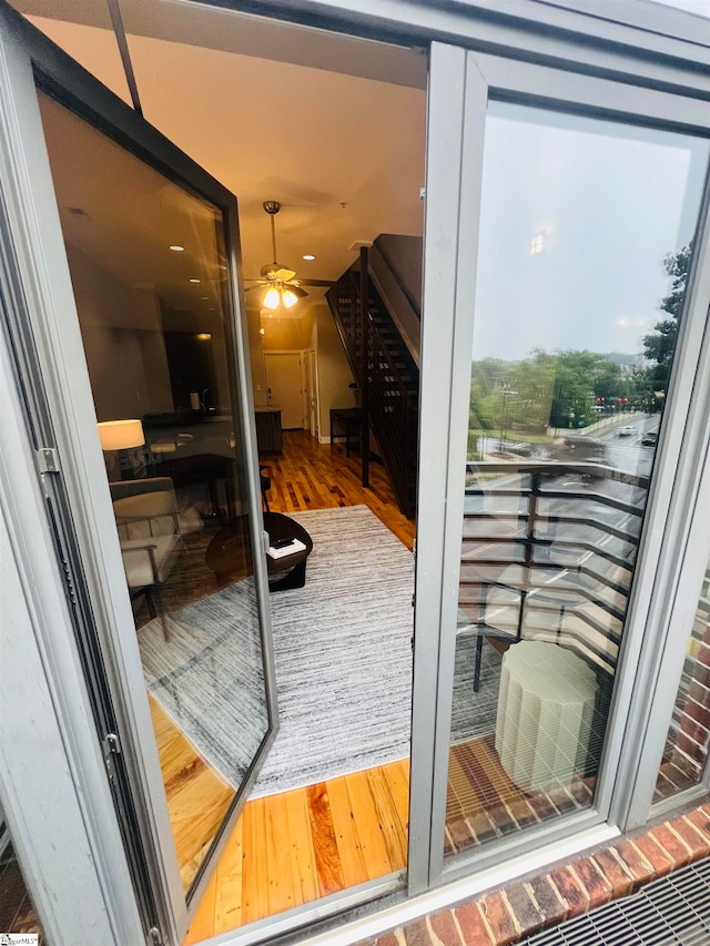 entryway with hardwood / wood-style flooring and ceiling fan