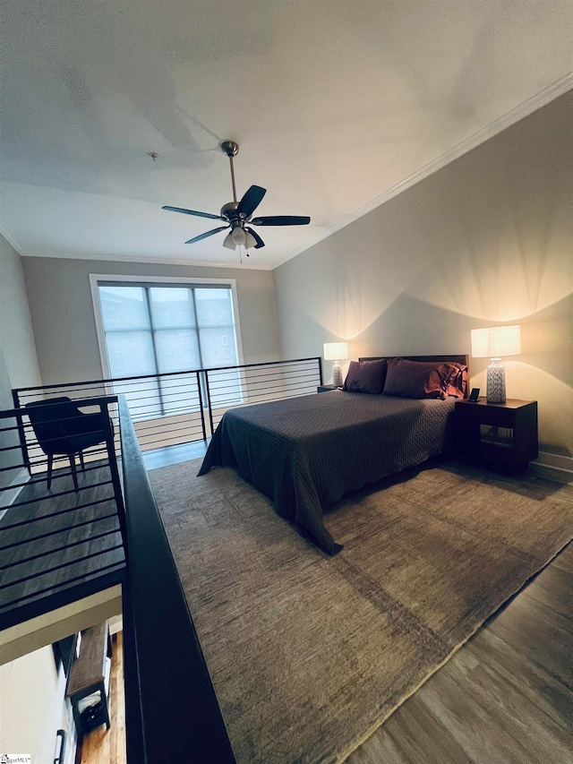 bedroom with ceiling fan, wood-type flooring, and ornamental molding