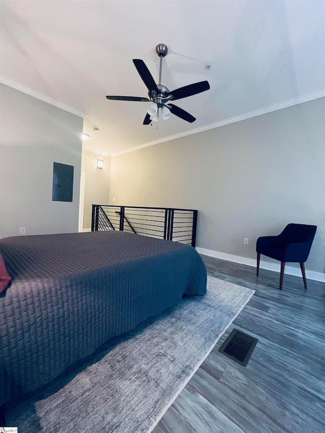 bedroom featuring ceiling fan, hardwood / wood-style flooring, and ornamental molding