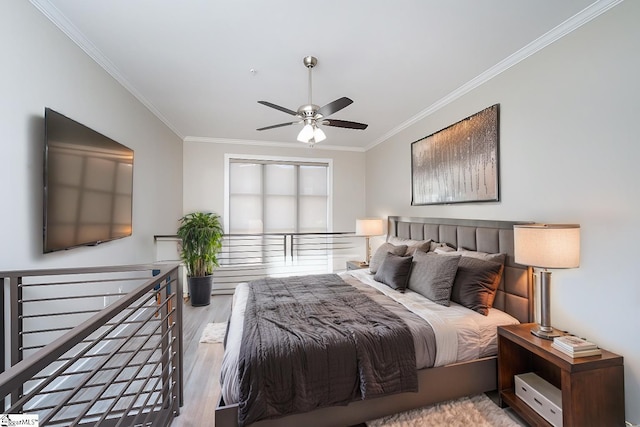 bedroom featuring crown molding, ceiling fan, and light hardwood / wood-style floors