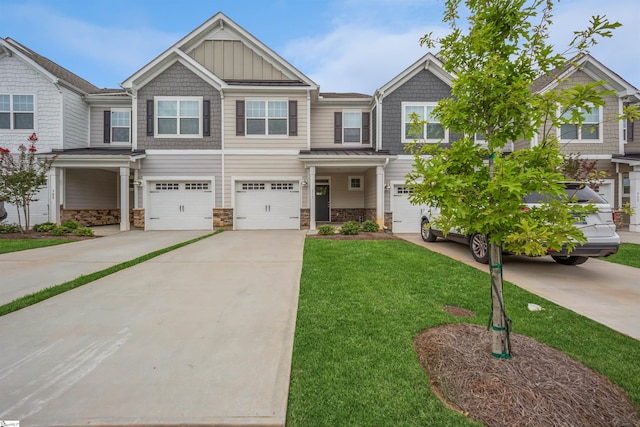 view of front of house with a garage and a front lawn