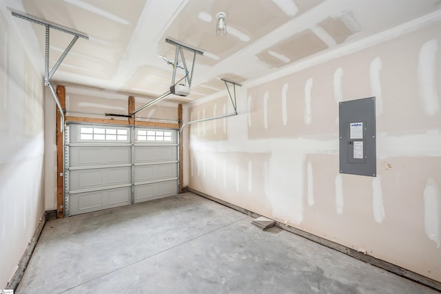 garage with electric panel and a garage door opener