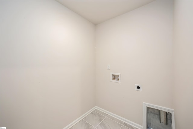 clothes washing area with electric dryer hookup, tile patterned flooring, and washer hookup