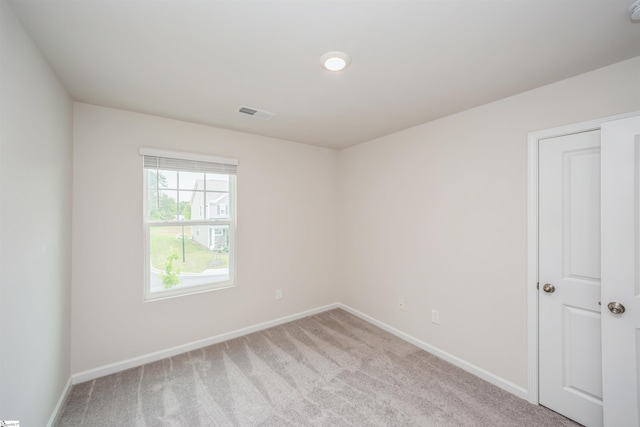 empty room with carpet flooring