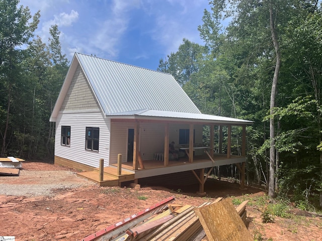 view of front of property with a wooden deck