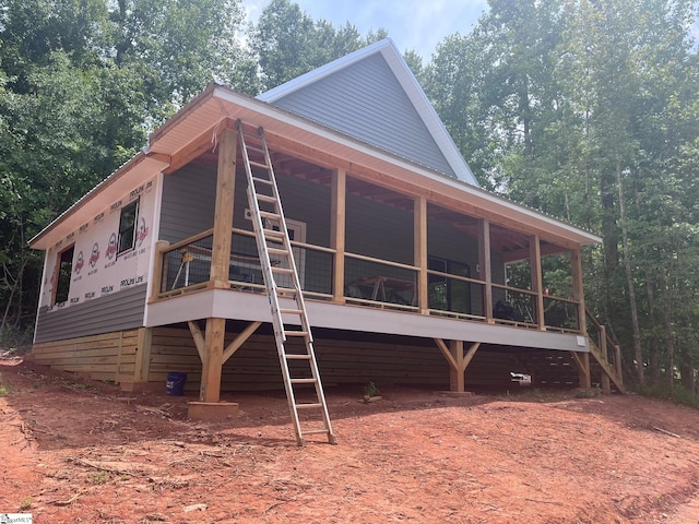 exterior space featuring a sunroom