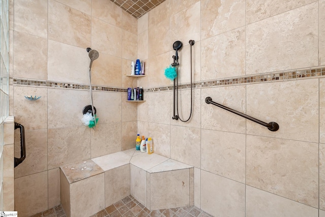 bathroom with a tile shower