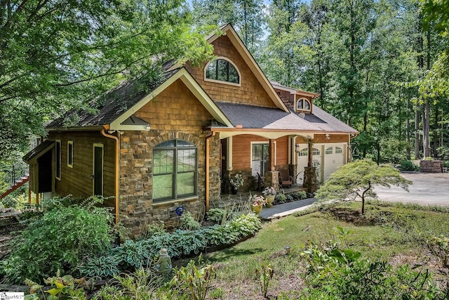 view of front of house featuring a garage and a porch