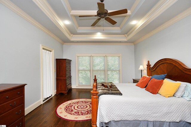 bedroom with ceiling fan, crown molding, a raised ceiling, and dark hardwood / wood-style floors