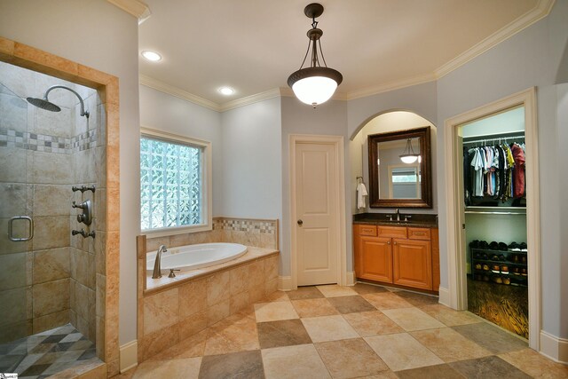 bathroom with vanity, tile patterned floors, crown molding, and independent shower and bath