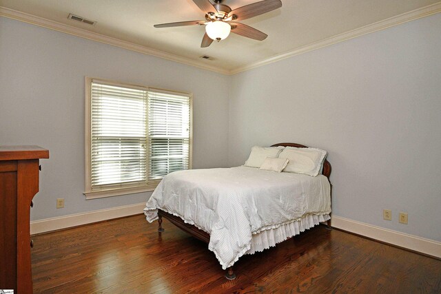 bedroom featuring ceiling fan, crown molding, and wood-type flooring