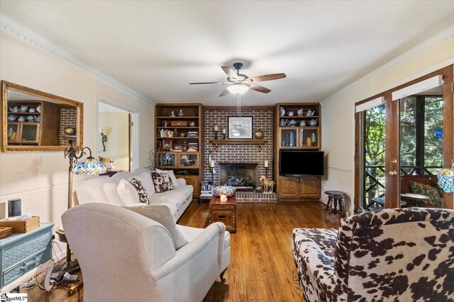 dining room featuring wood-type flooring, ornamental molding, and an inviting chandelier