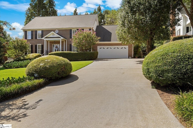 colonial inspired home featuring a garage