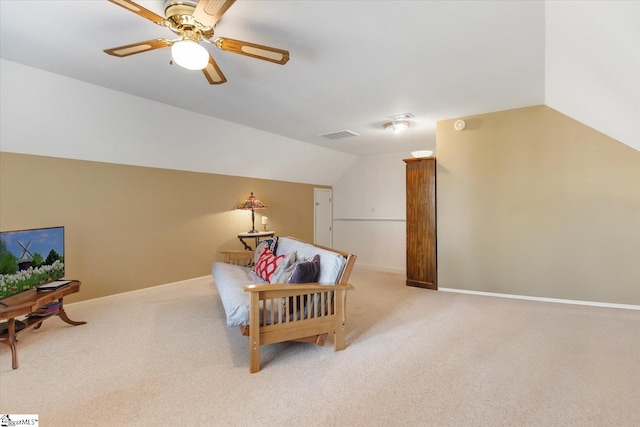 interior space featuring lofted ceiling, light colored carpet, and ceiling fan