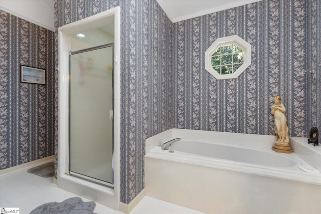 bathroom with shower with separate bathtub and tile patterned floors