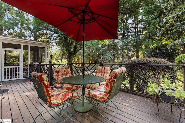 deck with a sunroom