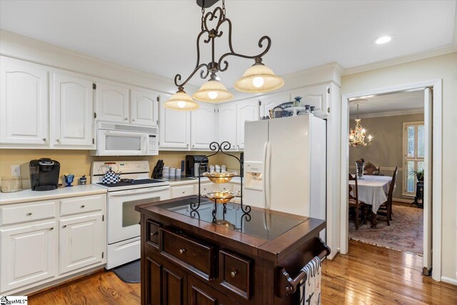 kitchen featuring white appliances, white cabinetry, ornamental molding, dark hardwood / wood-style floors, and decorative light fixtures