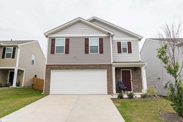 view of front of property featuring a garage and a front yard