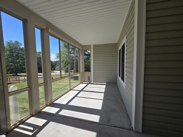 unfurnished sunroom featuring plenty of natural light