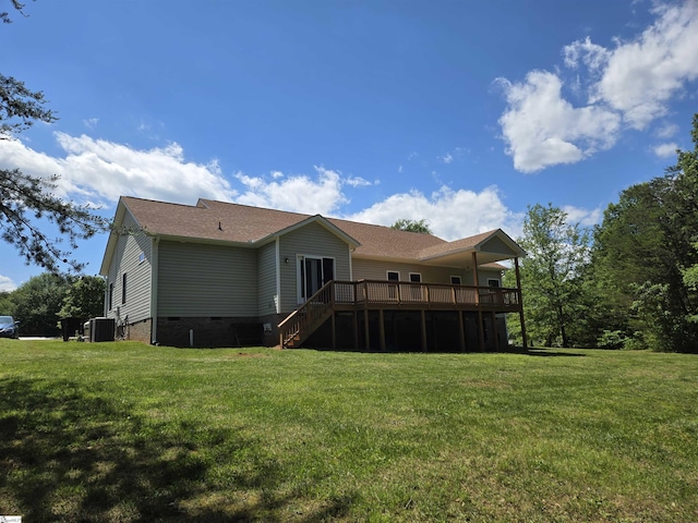 back of property featuring stairs, central AC unit, a deck, a yard, and crawl space