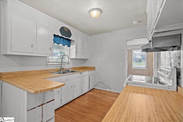 kitchen featuring white cabinetry, wooden counters, light wood-type flooring, white electric stove, and sink