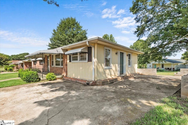 view of front of house featuring brick siding