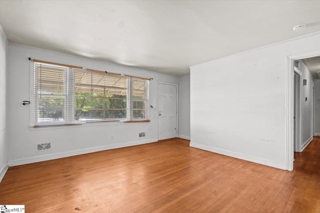 empty room featuring hardwood / wood-style floors